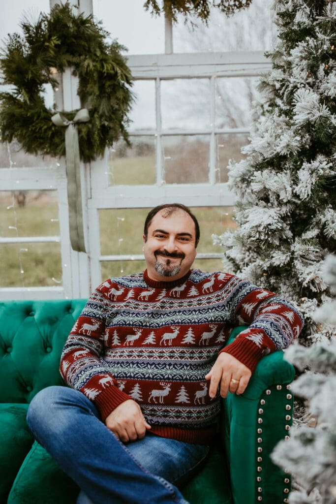 Photo of Mary's husband sitting on a couch.  Photo taken in Kitchener-Waterloo