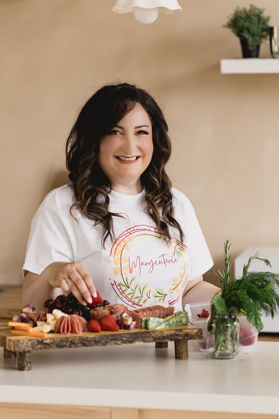Marycuterie founder preparing a luxury grazing board and offering business systems and consulting for food entrepreneurs