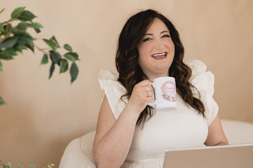 Photo of Mary, founder of Marycuterie, holding a coffee cup during a branding photoshoot with Portraits by Kendra in Kitchener-Waterloo